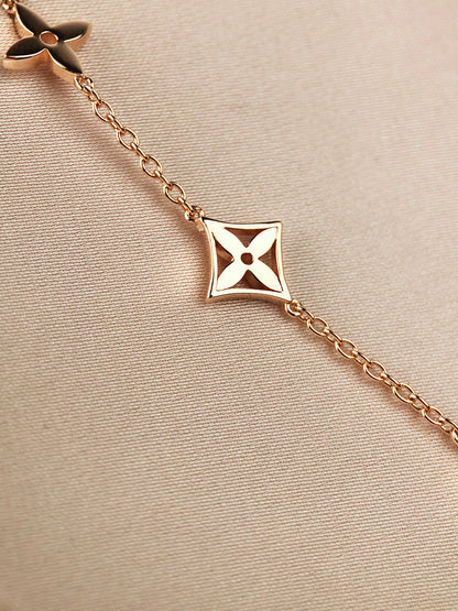 DIANA STAR AND SUN 7 MOTIFS GOLD BRACELET