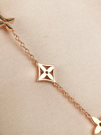 DIANA STAR AND SUN 7 MOTIFS GOLD BRACELET