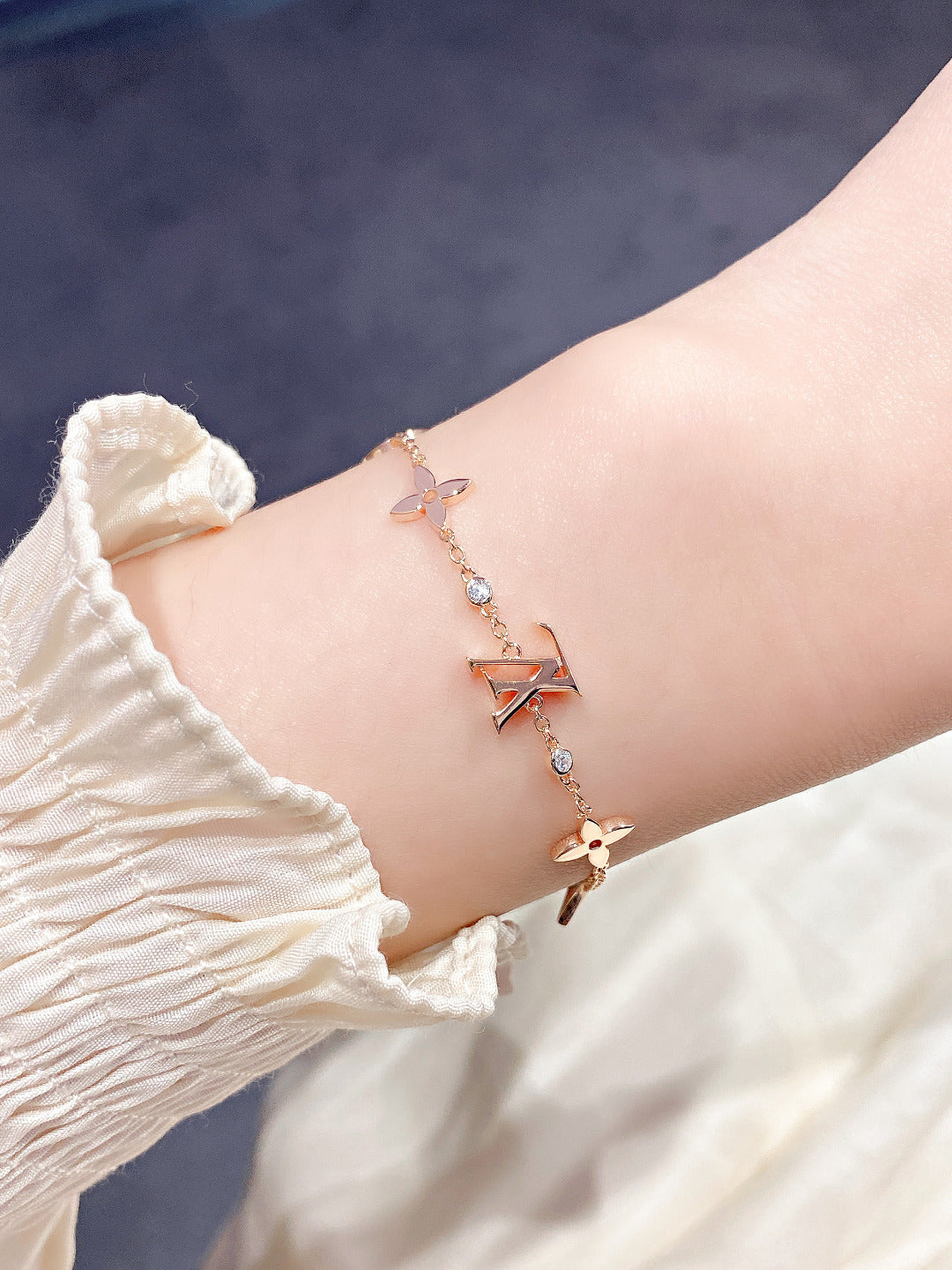 DIANA STAR AND SUN 7 MOTIFS GOLD BRACELET