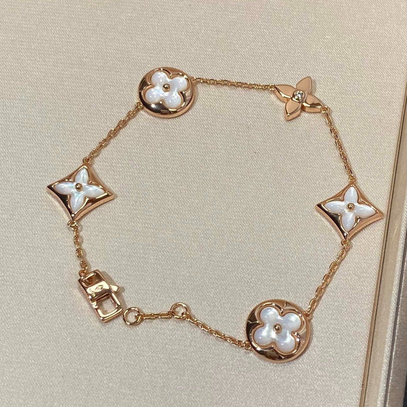 DIANA STAR AND SUN 5 MOTIF MOP PINK GOLD BRACELET