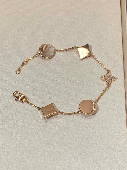 DIANA STAR AND SUN 5 MOTIF MOP PINK GOLD BRACELET