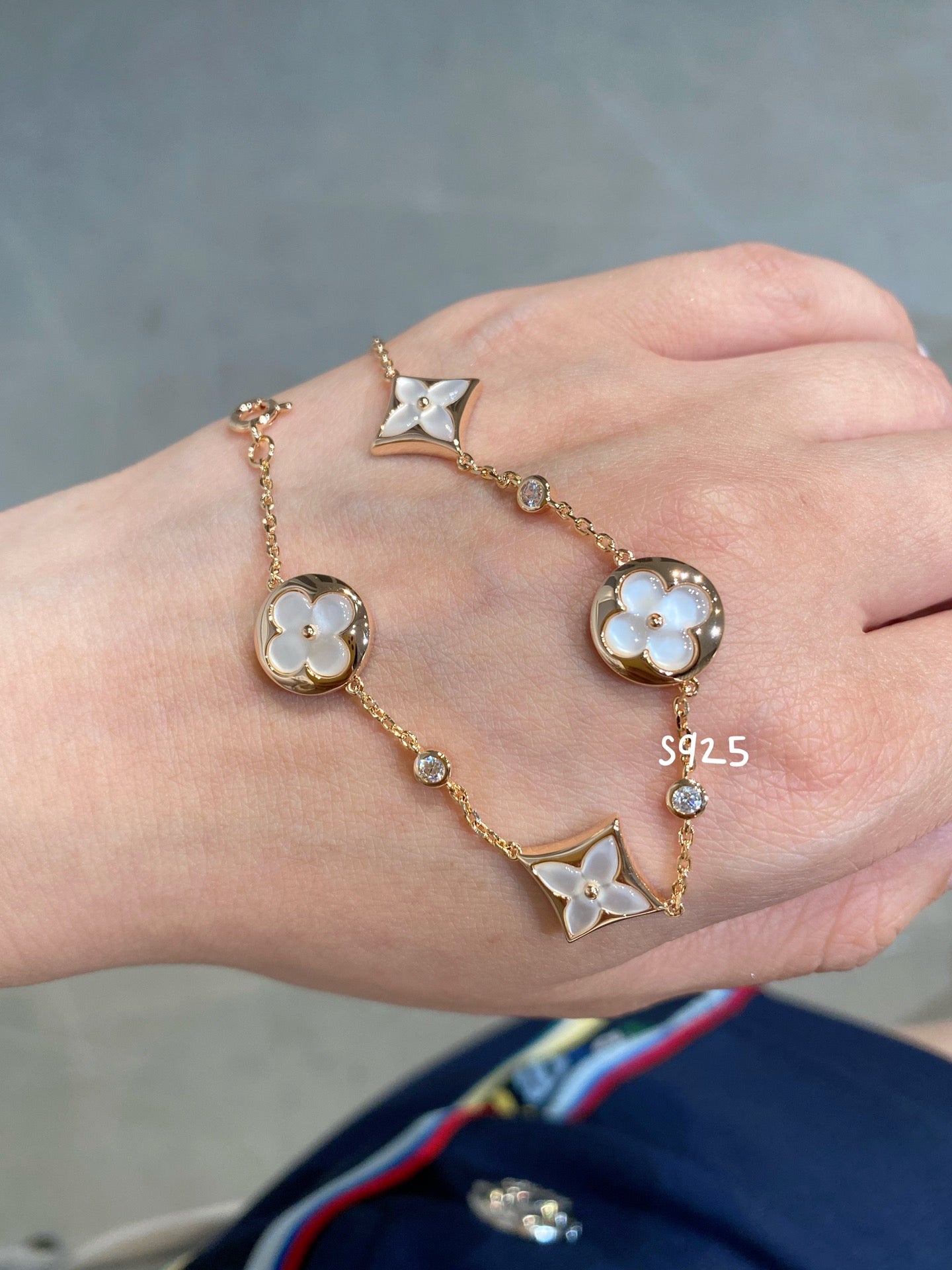 DIANA STAR AND SUN 4 MOTIF WHITE MOP PINK GOLD BRACELET