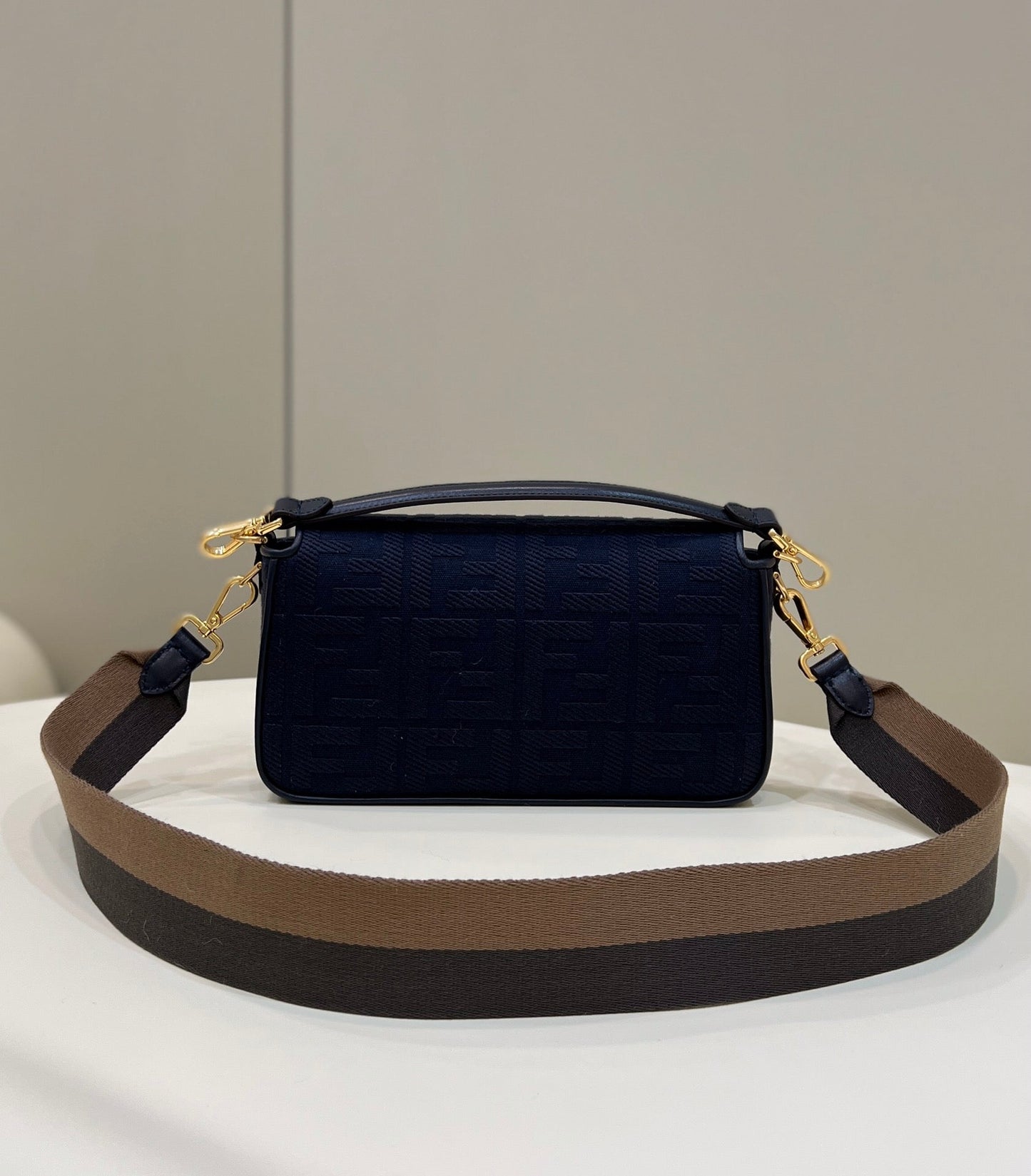 BAGUETTE WITH FF MOTIF 27 IN NAVY BLUE JACQUARD FABRIC GOLD HARDWARE