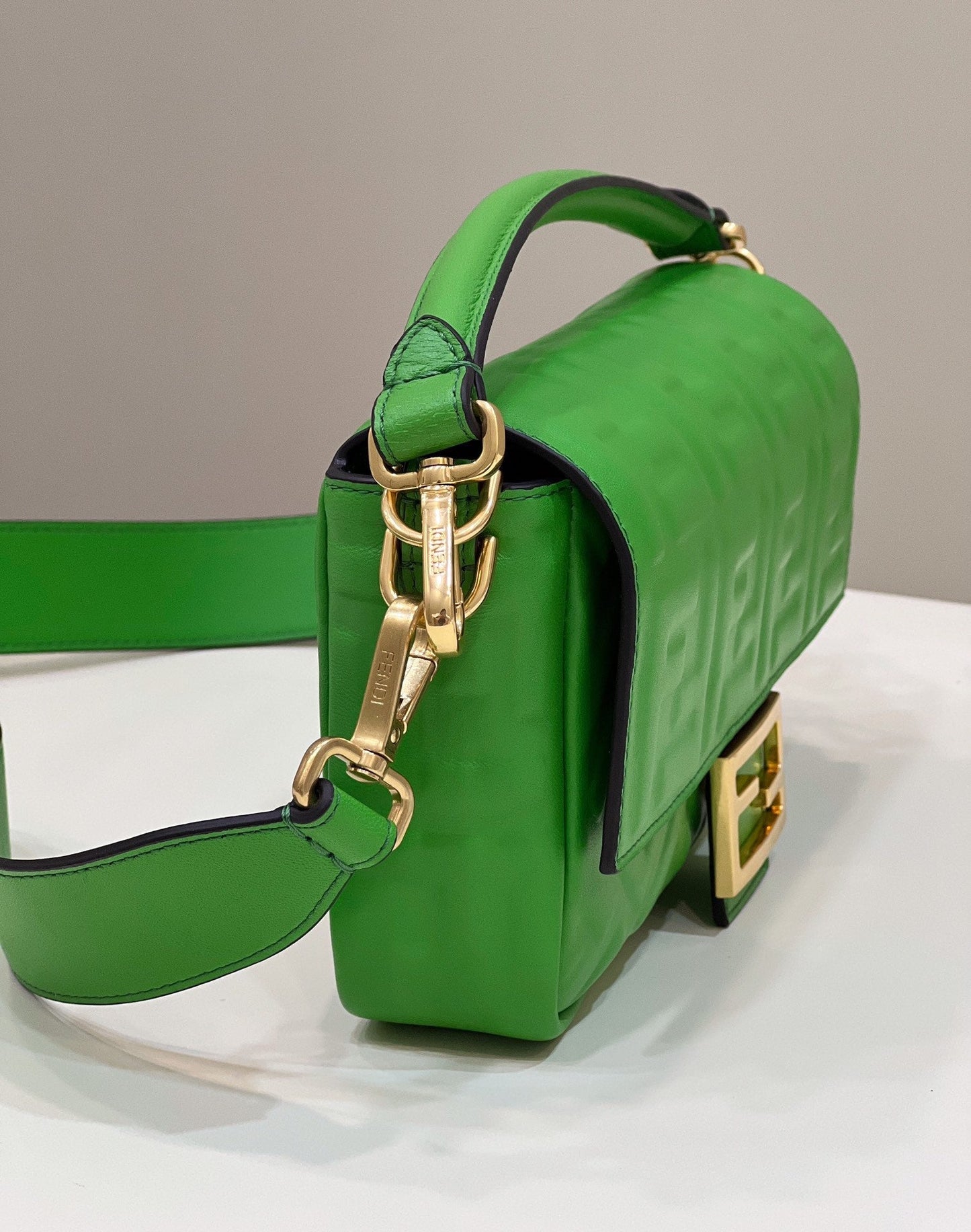 BAGUETTE WITH FF MOTIF 27 IN EMERALD GREEN SOFT LAMBSKIN GOLD HARDWARE