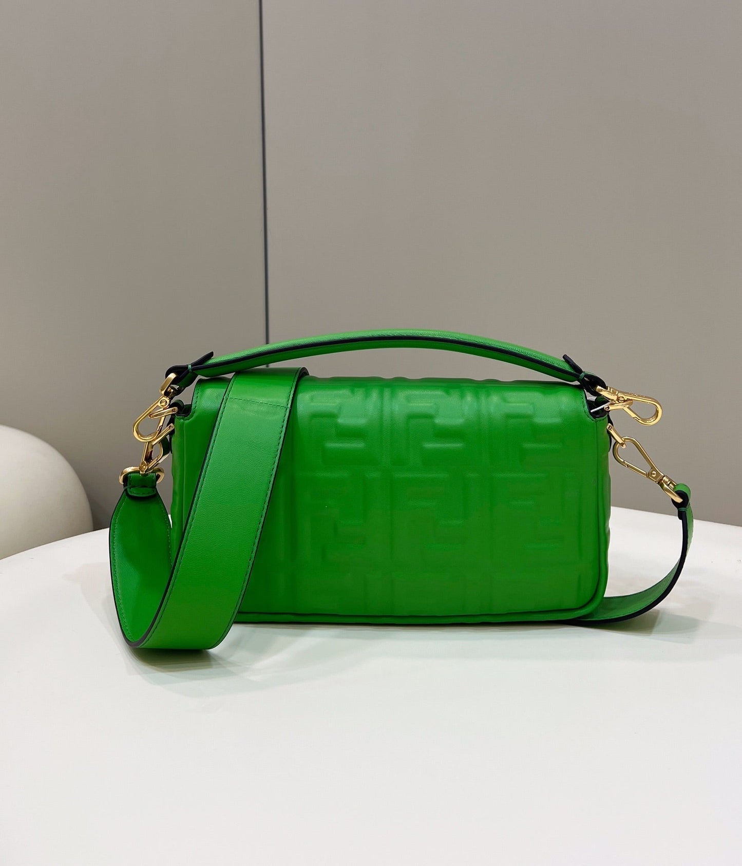 BAGUETTE WITH FF MOTIF 27 IN EMERALD GREEN SOFT LAMBSKIN GOLD HARDWARE