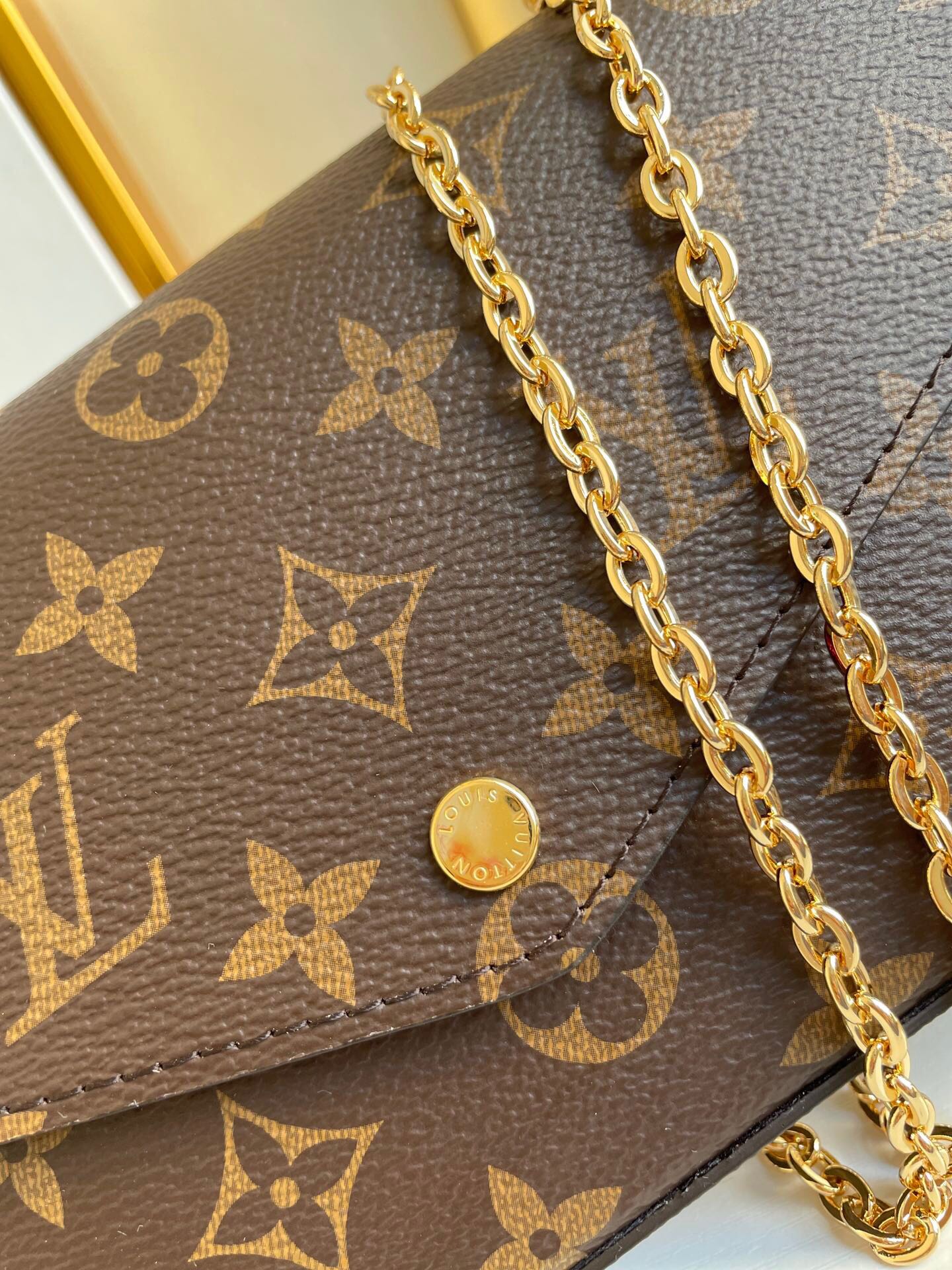 F¨¦LICIE POCHETTE 21 IN BROWN MONOGRAM CANVAS GOLD HARDWARE