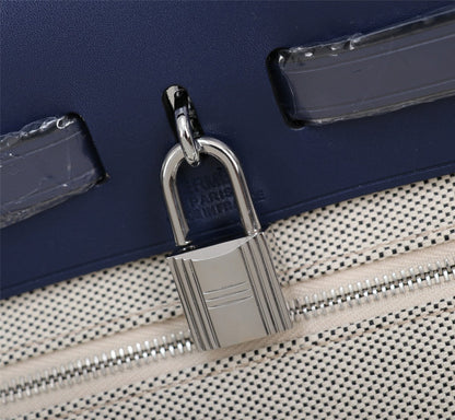 HM HERBAG ZIP 31 NAVY AND CREAM MONOGRAM CANVAS