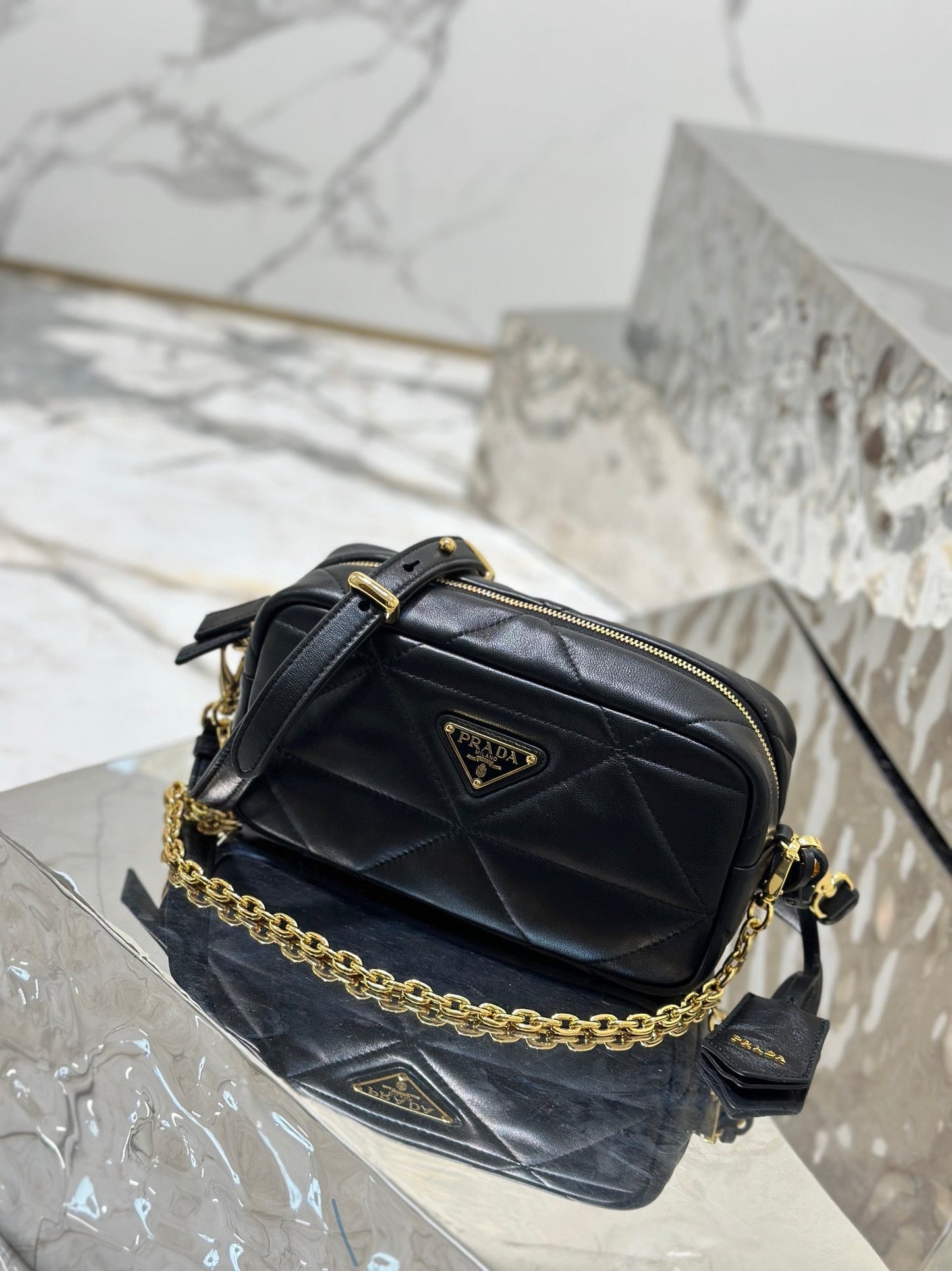 CAMERA BAG 22 IN BLACK TRIANGLE PATTERN QUILTED LAMBSKIN GOLD HARDWARE