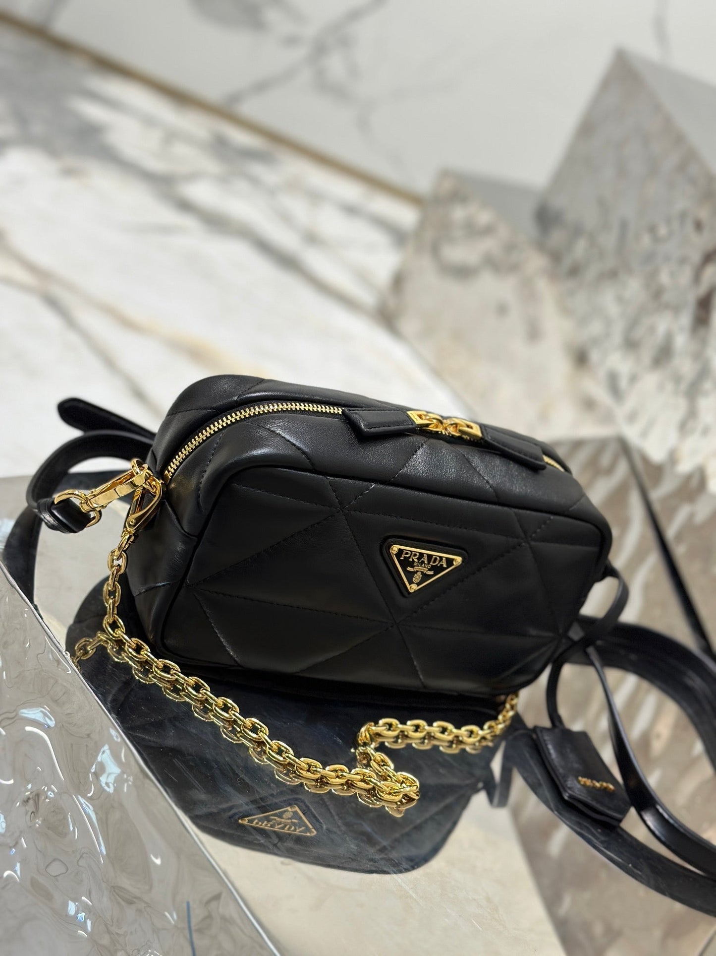 CAMERA BAG 22 IN BLACK TRIANGLE PATTERN QUILTED LAMBSKIN GOLD HARDWARE