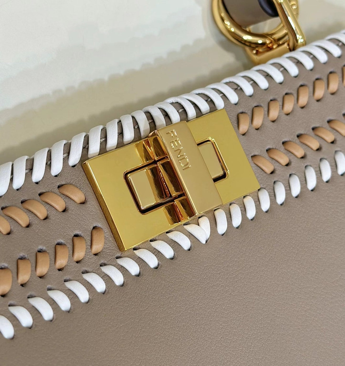 PEEKABOO ISEEU 27 IN MEDIUM BROWN INTERLACED CALFSKIN GOLD HARDWARE