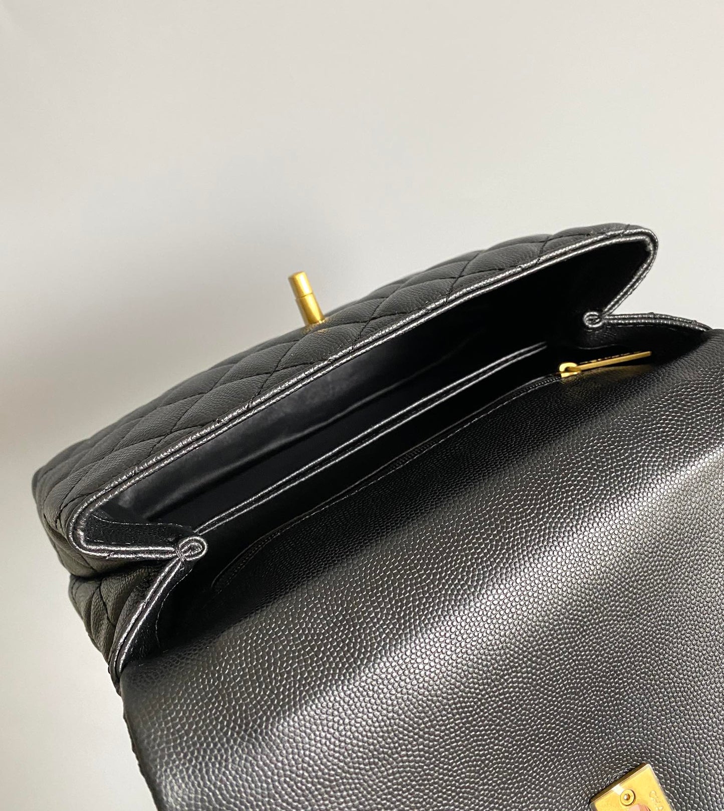 coco handle flap bag 23cm black quilted caviar gold hardware