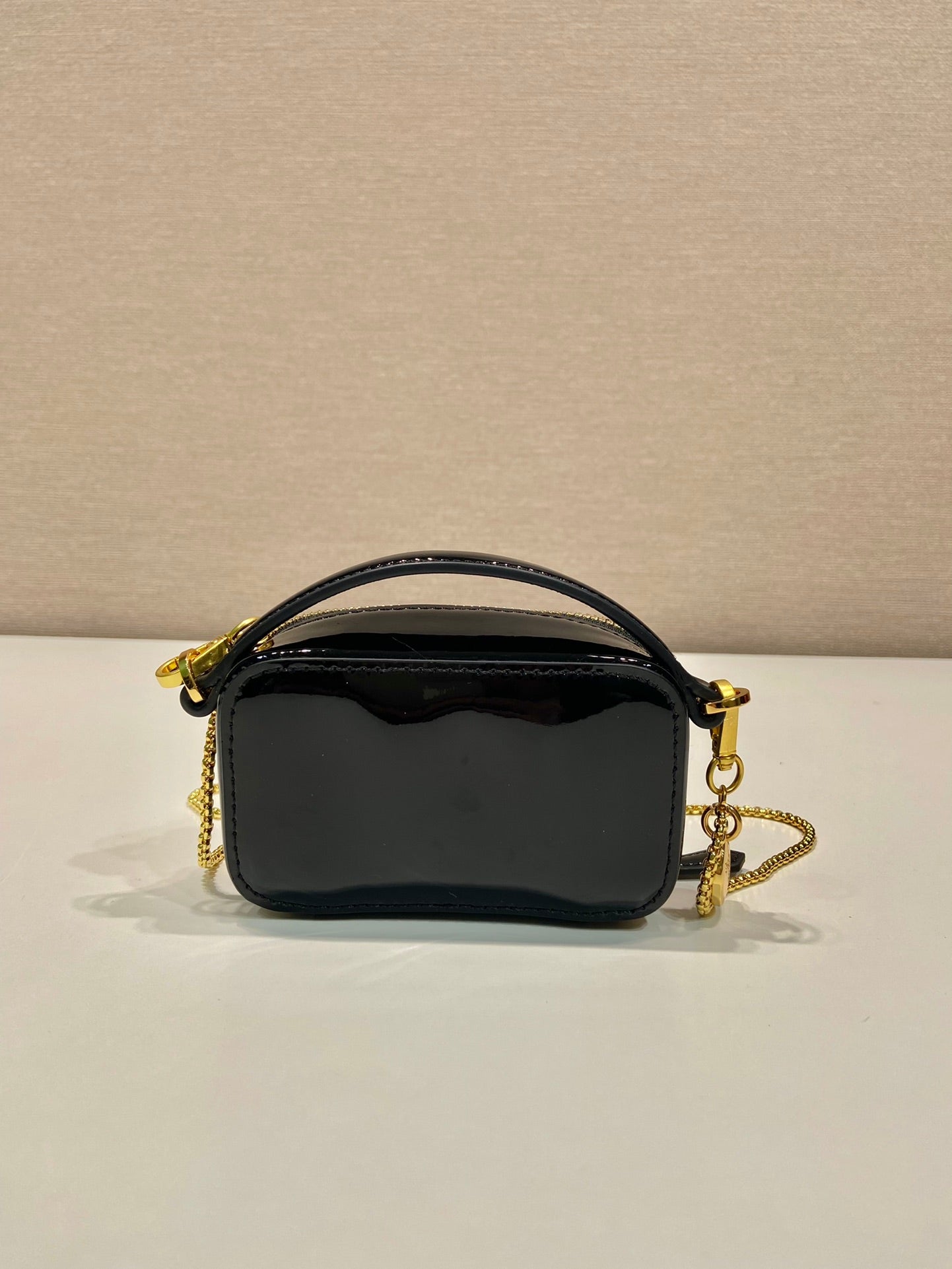 MINI HAND BAG 11 WITH GOLD STRAP IN BLACK PATENT CALFSKIN