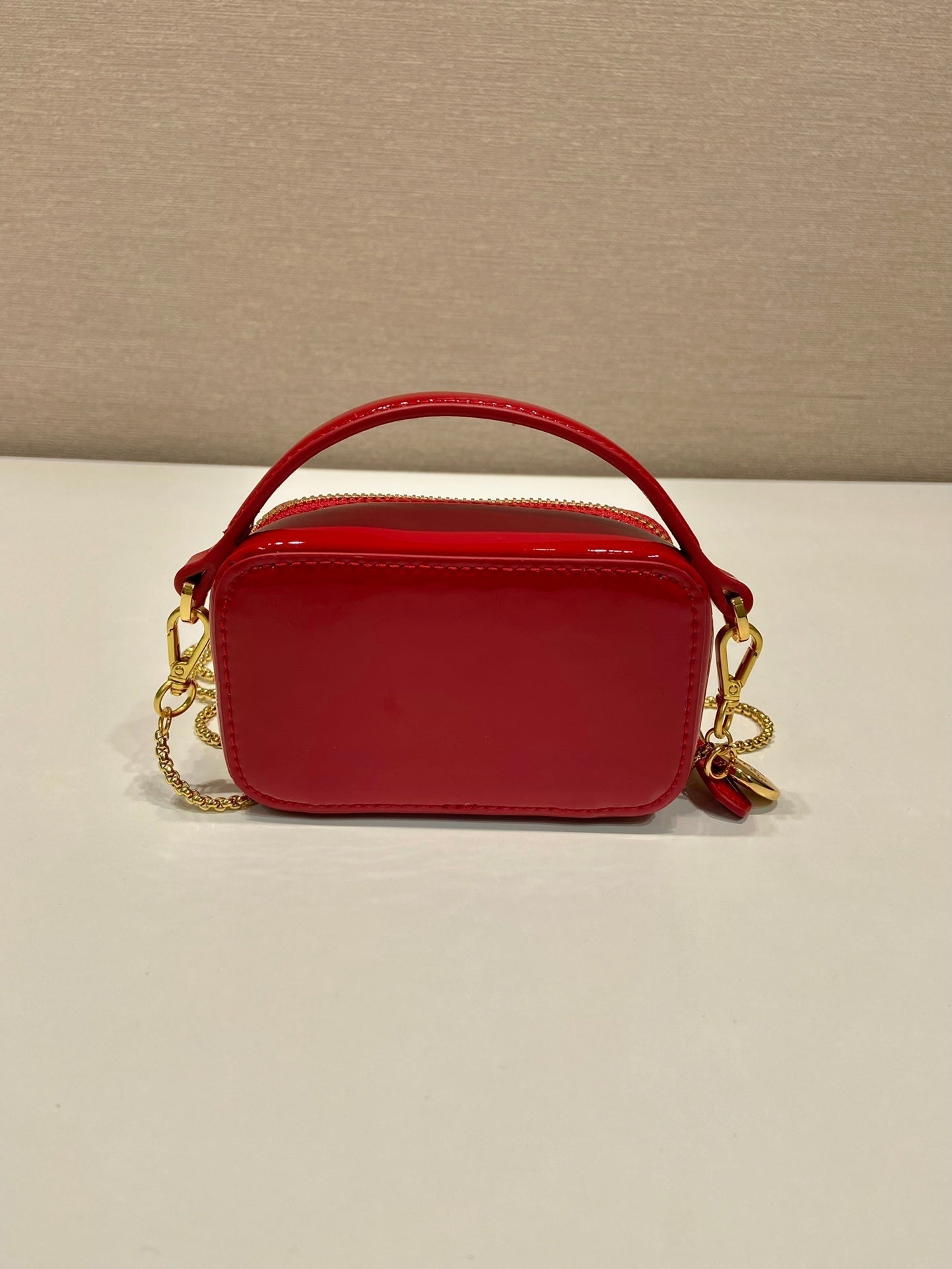 MINI HAND BAG 11 WITH GOLD STRAP IN RED PATENT CALFSKIN