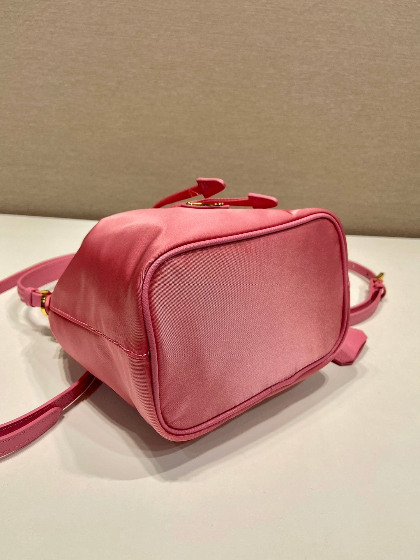 BUCKET BAG 19 IN CANDY PINK RE-NYLON AND SAFFIANO LEATHER HANDLE