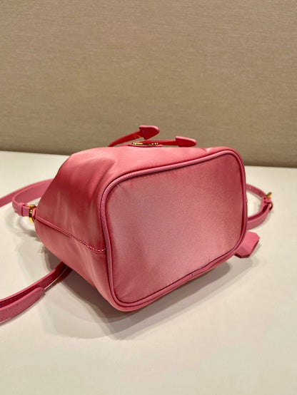BUCKET BAG 19 IN CANDY PINK RE-NYLON AND SAFFIANO LEATHER HANDLE