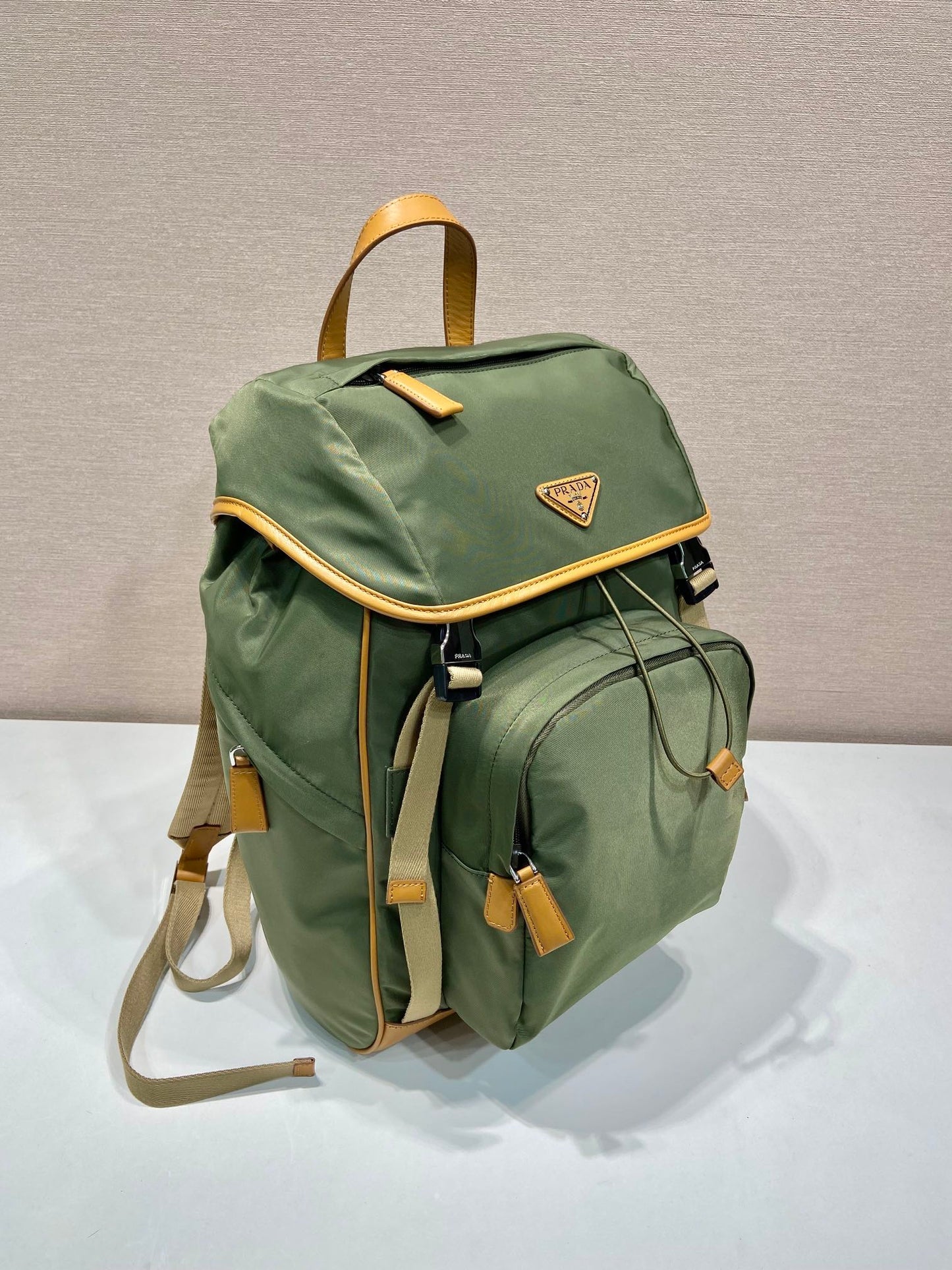 BACKPACK 45 IN SEAWEED GREEN RE-NYLON AND BROWN CALFSKIN TRIM