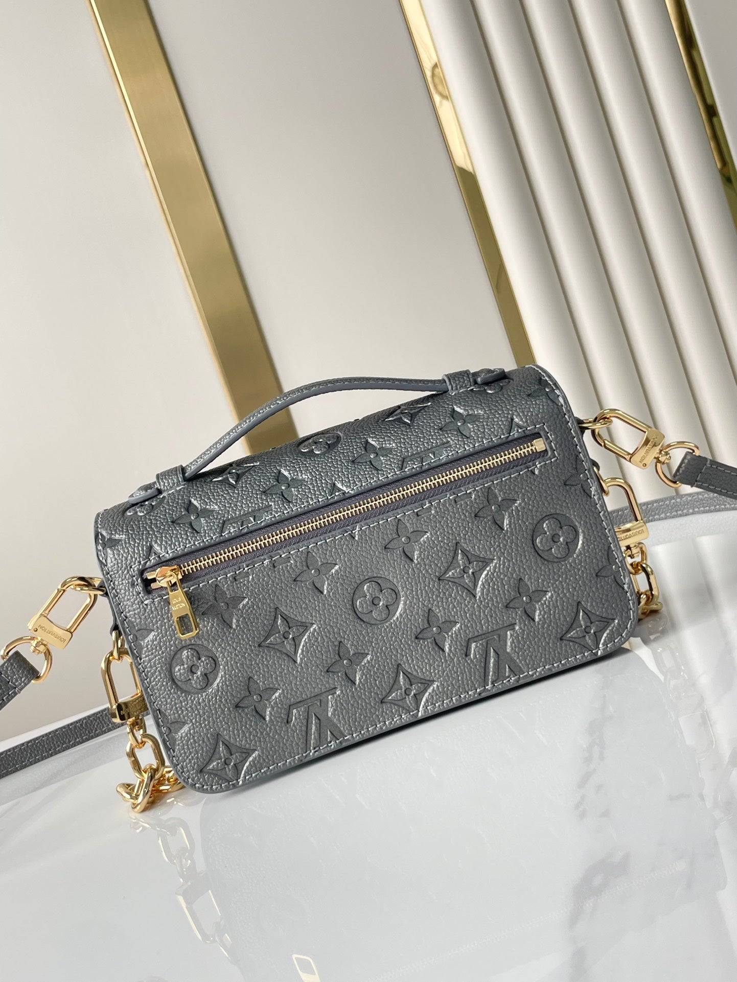 POCHETTE M¨¦TIS EAST WEST 21 IN GUN METAL EMBOSSED CALFSKIN GOLD HARDWARE
