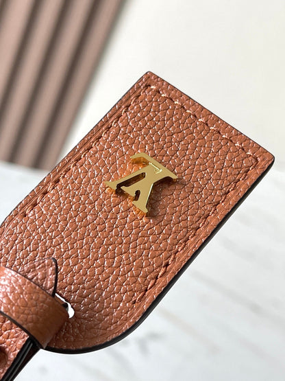 CARRYALL PM 29 IN COGNAC MONOGRAM EMPREINTE LEATHER GOLD LOGO