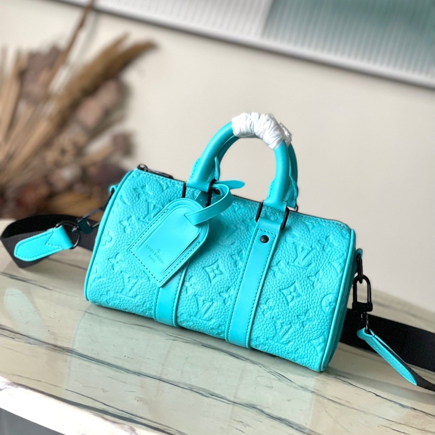 KEEPALL BANDOULI¨¨RE 25 IN TURQUOISE BLUE MONOGRAM EMBOSSED CALFSKIN