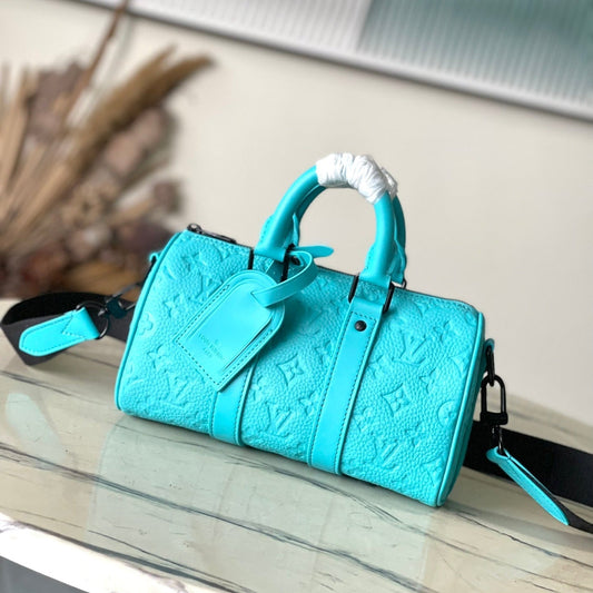 KEEPALL BANDOULI¨¨RE 25 IN TURQUOISE BLUE MONOGRAM EMBOSSED CALFSKIN
