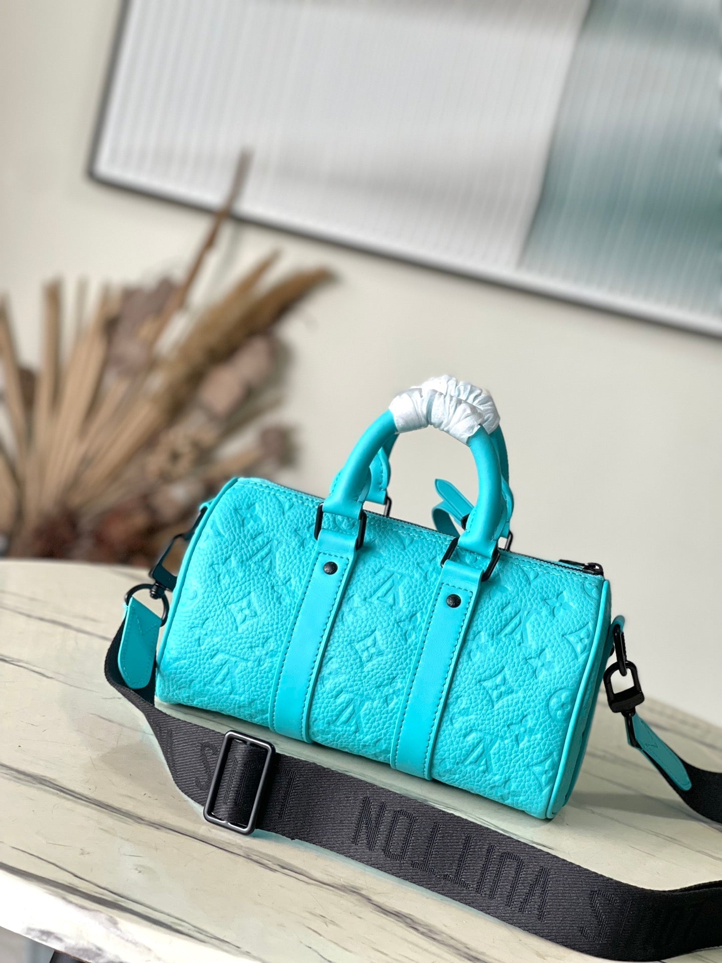 KEEPALL BANDOULI¨¨RE 25 IN TURQUOISE BLUE MONOGRAM EMBOSSED CALFSKIN
