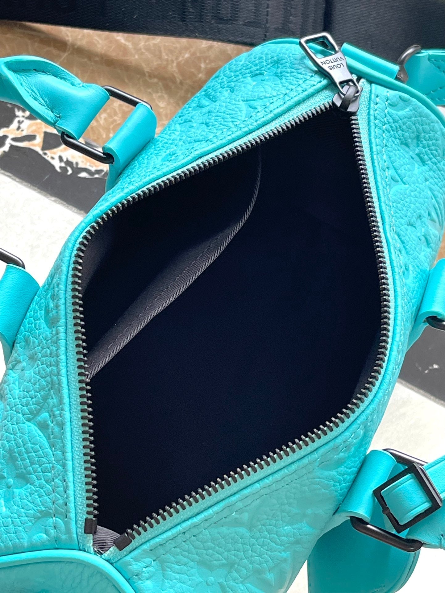 KEEPALL BANDOULI¨¨RE 25 IN TURQUOISE BLUE MONOGRAM EMBOSSED CALFSKIN