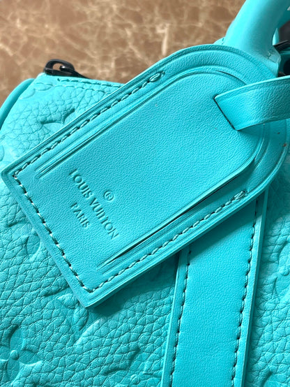 KEEPALL BANDOULI¨¨RE 25 IN TURQUOISE BLUE MONOGRAM EMBOSSED CALFSKIN