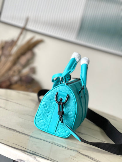 KEEPALL BANDOULI¨¨RE 25 IN TURQUOISE BLUE MONOGRAM EMBOSSED CALFSKIN