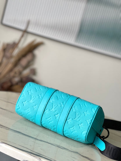 KEEPALL BANDOULI¨¨RE 25 IN TURQUOISE BLUE MONOGRAM EMBOSSED CALFSKIN