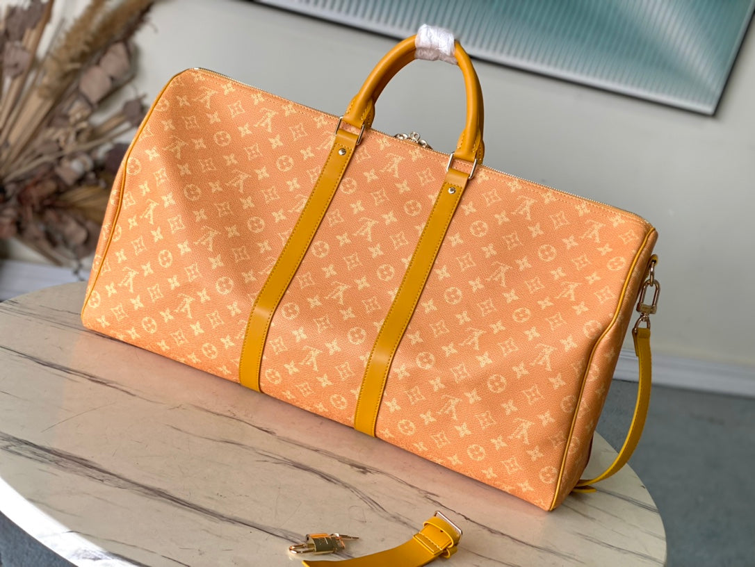 KEEPALL BANDOULI¨¨RE 55 IN ORANGE MONOGRAM HERITAGE CANVAS