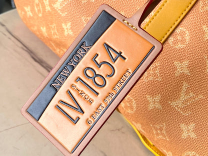 KEEPALL BANDOULI¨¨RE 55 IN ORANGE MONOGRAM HERITAGE CANVAS