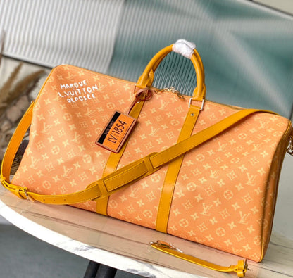 KEEPALL BANDOULI¨¨RE 55 IN ORANGE MONOGRAM HERITAGE CANVAS