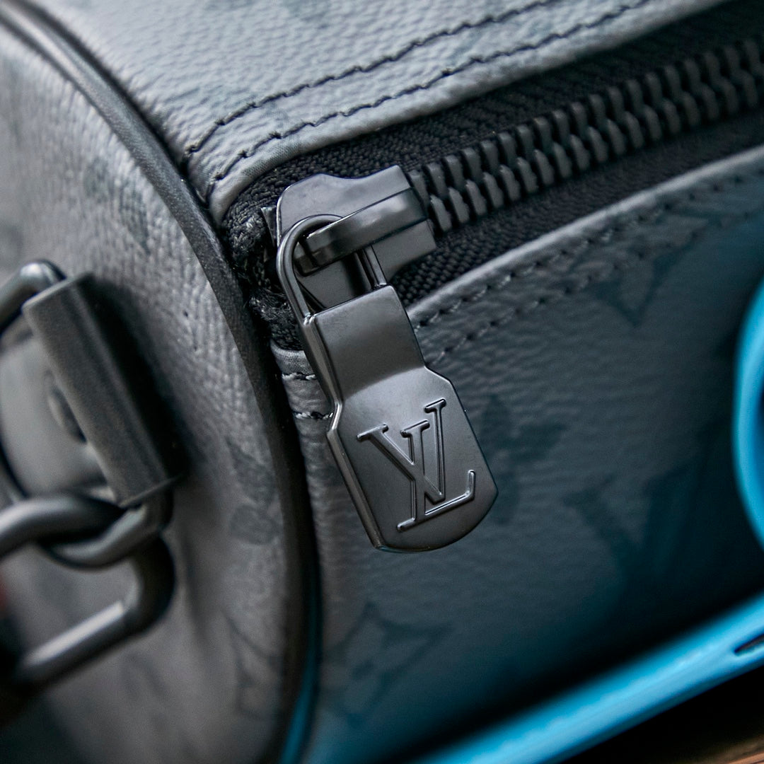 KEEPALL BANDOULI¨¨RE 25 IN GUN METAL MONOGRAM ECLIPSE CANVAS MIX TURQUOISE CALFSKIN