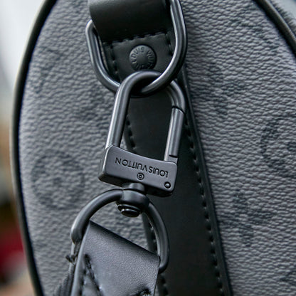 KEEPALL BANDOULI¨¨RE 25 IN GUN METAL MONOGRAM ECLIPSE CANVAS MIX TURQUOISE CALFSKIN