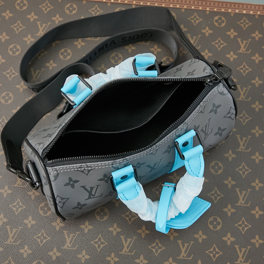KEEPALL BANDOULI¨¨RE 25 IN GUN METAL MONOGRAM ECLIPSE CANVAS MIX TURQUOISE CALFSKIN