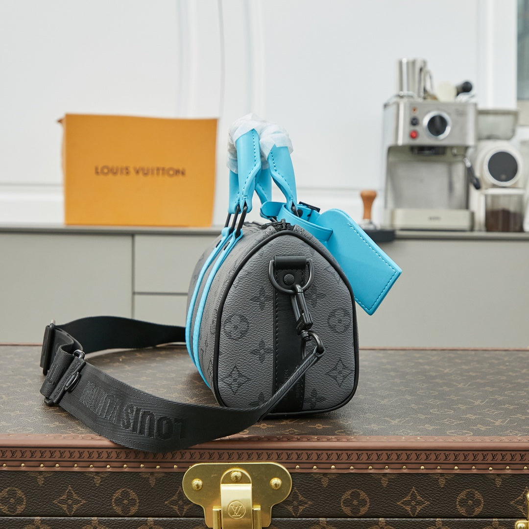 KEEPALL BANDOULI¨¨RE 25 IN GUN METAL MONOGRAM ECLIPSE CANVAS MIX TURQUOISE CALFSKIN