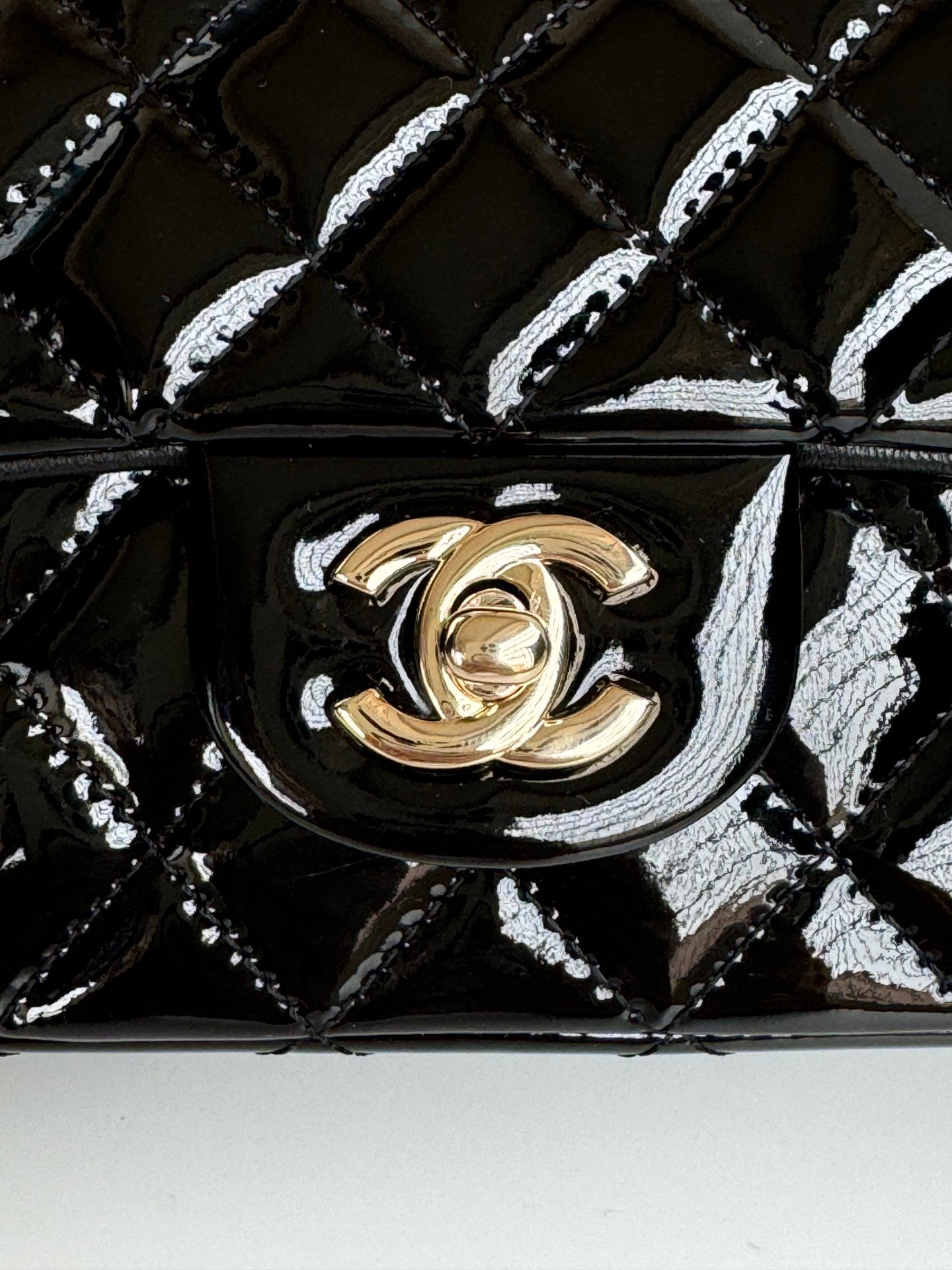 24c mini flap bag 20cm with top handle black patent calfskin