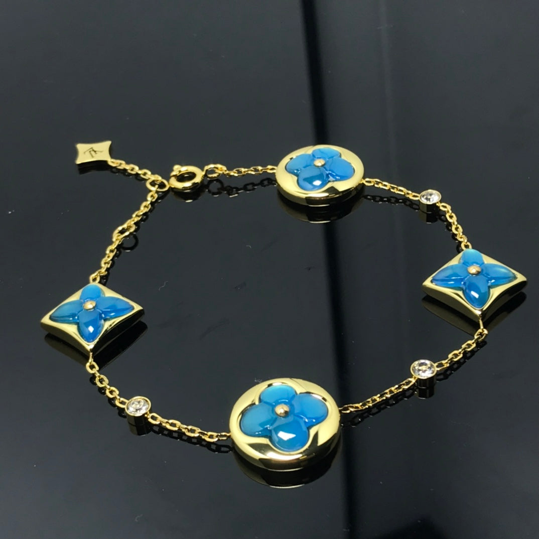 DIANA STAR AND SUN 4 MOTIF BLUE BRACELET